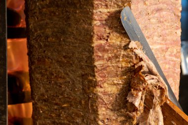 Doner kebab. Turkish doner kebab cooked in wood fire. close up