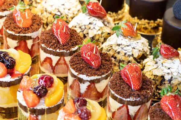 Types of cakes. Cakes on display at the patisserie counter. close up