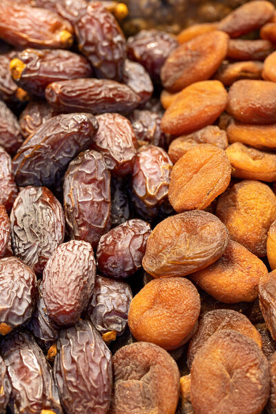 Dates fruit and dried apricots. healthy foods. Close-up.