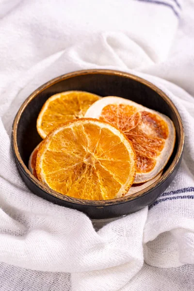 Dried orange slices. Sliced dried orange on a white background. Sun-dried fruit. close up