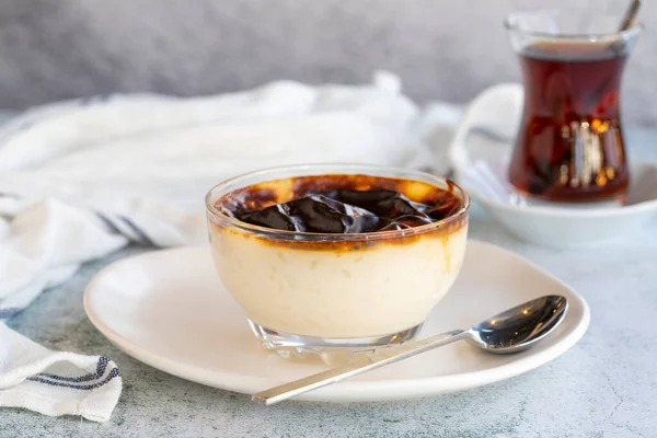 Rice pudding. Rice pudding dessert made of milk, sugar and rice on a stone background. Turkish cuisine delicacies. close up