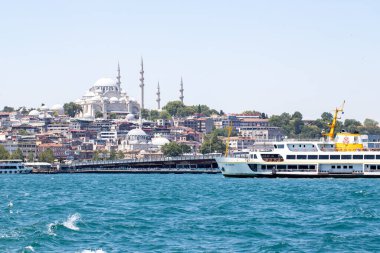 Istanbul, Turkey - july 2022: View of Istanbul historical peninsula from the sea. Along with the Galata bridge and the city lines ferry. Istanbul cityscape. Landmarks.