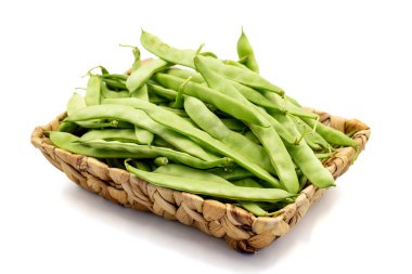Ripe green beans. Fresh and raw green beans in basket isolated on white background. Organic food. close up