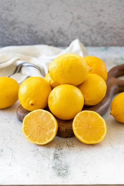 Fresh lemon. Half cut lemon on stone background. close up