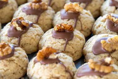 Walnut cookies. Freshly baked chocolate walnut cookies in a tray. close up