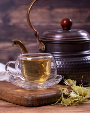 Linden tea. Linden tea on wood floor. Herbal tea concept. Healthy drinks. close up