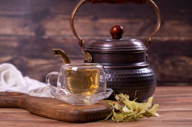 Linden tea. Linden tea on wood floor. Herbal tea concept. Healthy drinks. close up