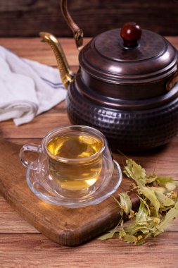 Linden tea. Linden tea on wood floor. Herbal tea concept. Healthy drinks. close up