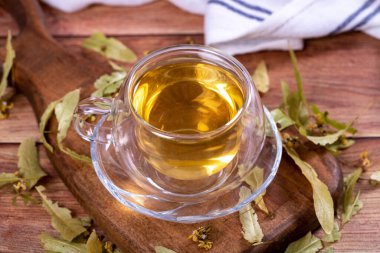 Linden tea. Linden tea on wood floor. Herbal tea concept. Healthy drinks. close up