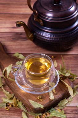 Linden tea. Linden tea on wood floor. Herbal tea concept. Healthy drinks. close up