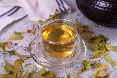 Linden tea. Linden tea on stone background. Herbal tea concept. Healthy drinks. close up