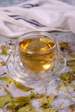 Linden tea. Linden tea on stone background. Herbal tea concept. Healthy drinks. close up