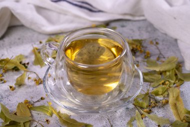 Linden tea. Linden tea on stone background. Herbal tea concept. Healthy drinks. close up