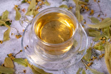 Linden tea. Linden tea on stone background. Herbal tea concept. Healthy drinks. close up