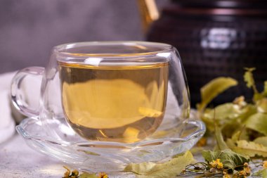 Linden tea. Linden tea on stone background. Herbal tea concept. Healthy drinks. close up