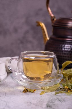 Linden tea. Linden tea on stone background. Herbal tea concept. Healthy drinks. close up