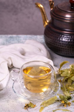 Linden tea. Linden tea on stone background. Herbal tea concept. Healthy drinks. close up