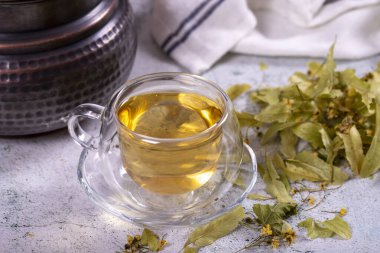Linden tea. Linden tea on stone background. Herbal tea concept. Healthy drinks. close up