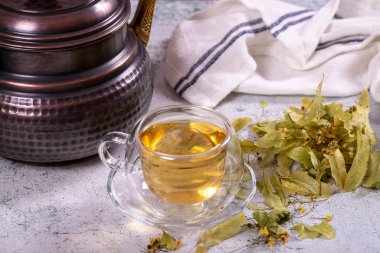 Linden tea. Linden tea on stone background. Herbal tea concept. Healthy drinks. close up