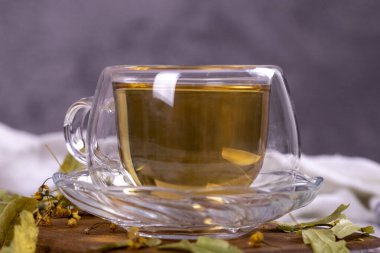 Linden tea. Linden tea on stone background. Herbal tea concept. Healthy drinks. close up