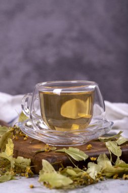 Linden tea. Linden tea on stone background. Herbal tea concept. Healthy drinks. close up