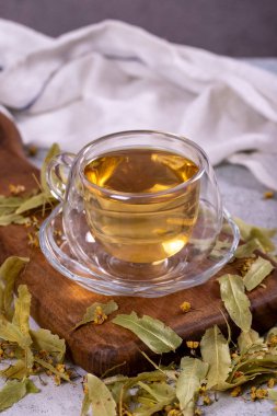 Linden tea. Linden tea on stone background. Herbal tea concept. Healthy drinks. close up
