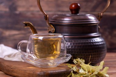 Linden tea. Linden tea on wood floor. Herbal tea concept. Healthy drinks. close up
