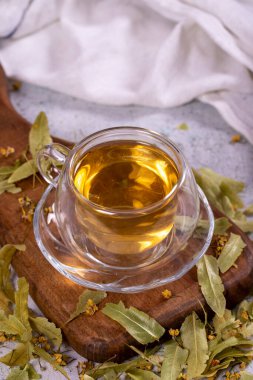 Linden tea. Linden tea on stone background. Herbal tea concept. Healthy drinks. close up