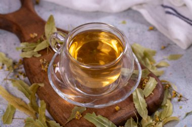Linden tea. Linden tea on stone background. Herbal tea concept. Healthy drinks. close up