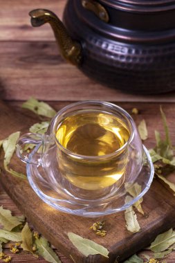 Linden tea. Linden tea on wood floor. Herbal tea concept. Healthy drinks. close up