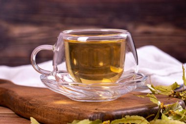 Linden tea. Linden tea on wood floor. Herbal tea concept. Healthy drinks. close up