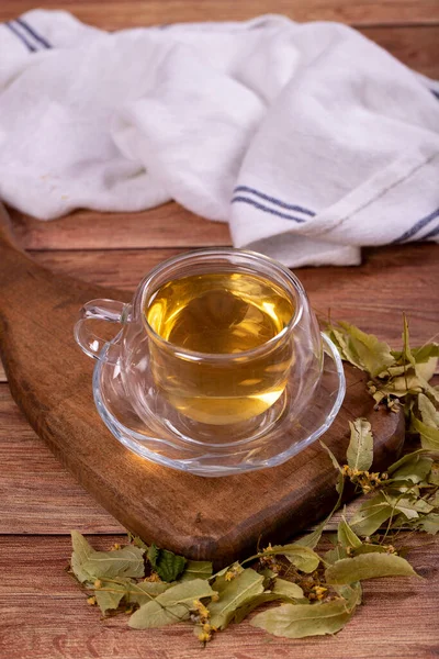 Linden tea. Linden tea on wood floor. Herbal tea concept. Healthy drinks. close up