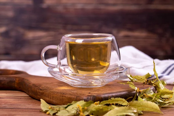 Linden tea. Linden tea on wood floor. Herbal tea concept. Healthy drinks. close up