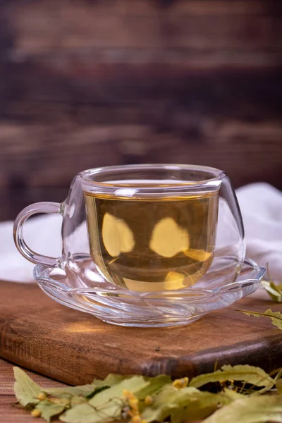 Linden tea. Linden tea on wood floor. Herbal tea concept. Healthy drinks. close up