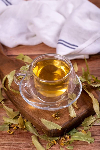 Linden tea. Linden tea on wood floor. Herbal tea concept. Healthy drinks. close up