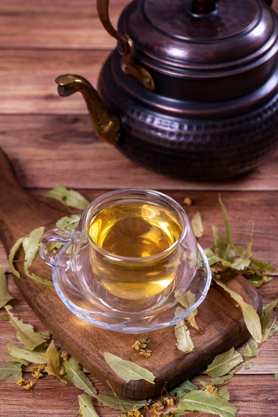 Linden tea. Linden tea on wood floor. Herbal tea concept. Healthy drinks. close up