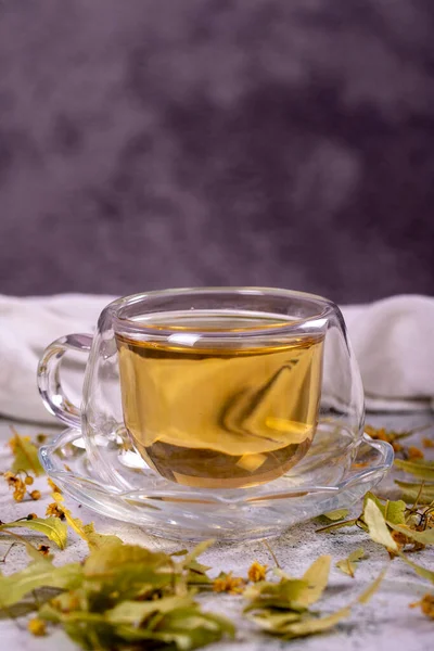 Linden tea. Linden tea on stone background. Herbal tea concept. Healthy drinks. close up