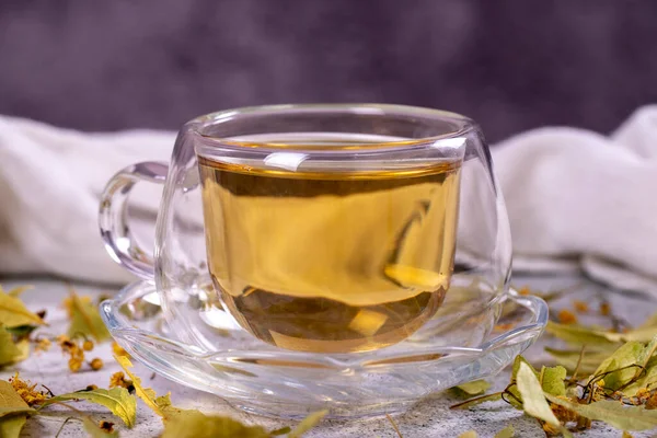 Linden tea. Linden tea on stone background. Herbal tea concept. Healthy drinks. close up
