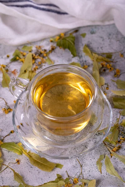 Linden tea. Linden tea on stone background. Herbal tea concept. Healthy drinks. close up