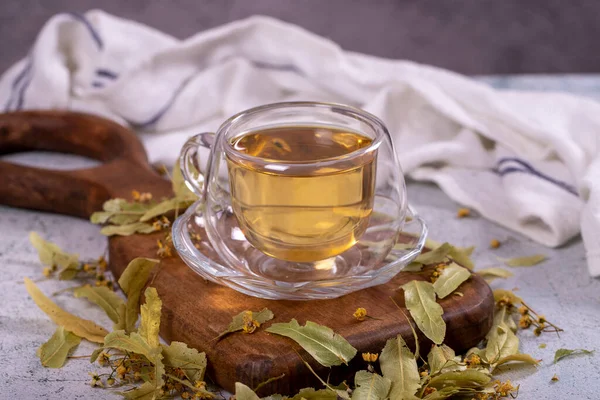 Linden tea. Linden tea on stone background. Herbal tea concept. Healthy drinks. close up