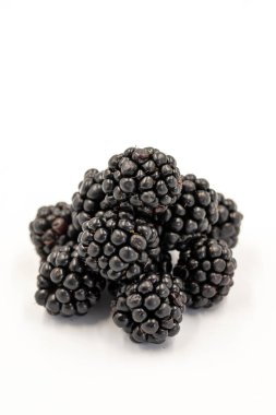 Black mulberry isolated on white background. Fresh and juicy black mulberry. Organic food. close up