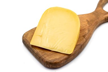 Yellow gouda cheese. Hard Dutch gouda cheese, isolated on white background. close up