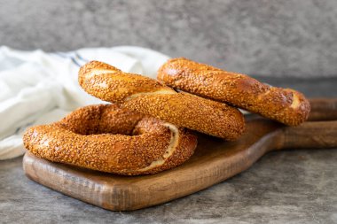 Sesame bagel. Turkish bagel on dark background. Bakery products. close up