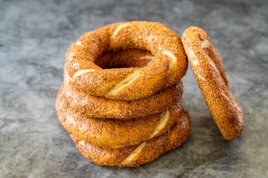 Sesame bagel. Turkish bagel on dark background. Bakery products. close up