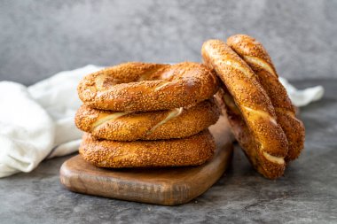 Sesame bagel. Turkish bagel on dark background. Bakery products. close up