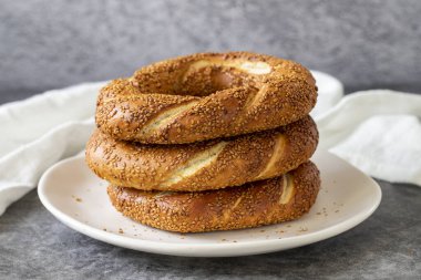 Sesame bagel. Turkish bagel on dark background. Bakery products. close up