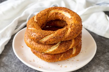 Sesame bagel. Turkish bagel on dark background. Bakery products. close up