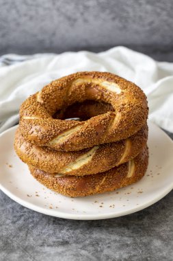 Sesame bagel. Turkish bagel on dark background. Bakery products. close up