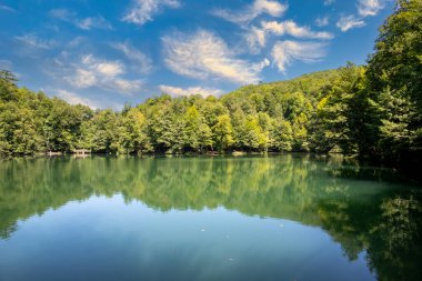 Lake hidden in the forest. Turkey Bolu Yedigoller. Lake view in cloudy weather
