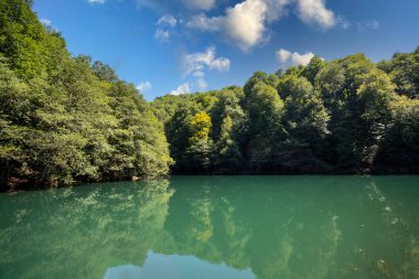 Lake hidden in the forest. Turkey Bolu Yedigoller. Lake view in cloudy weather